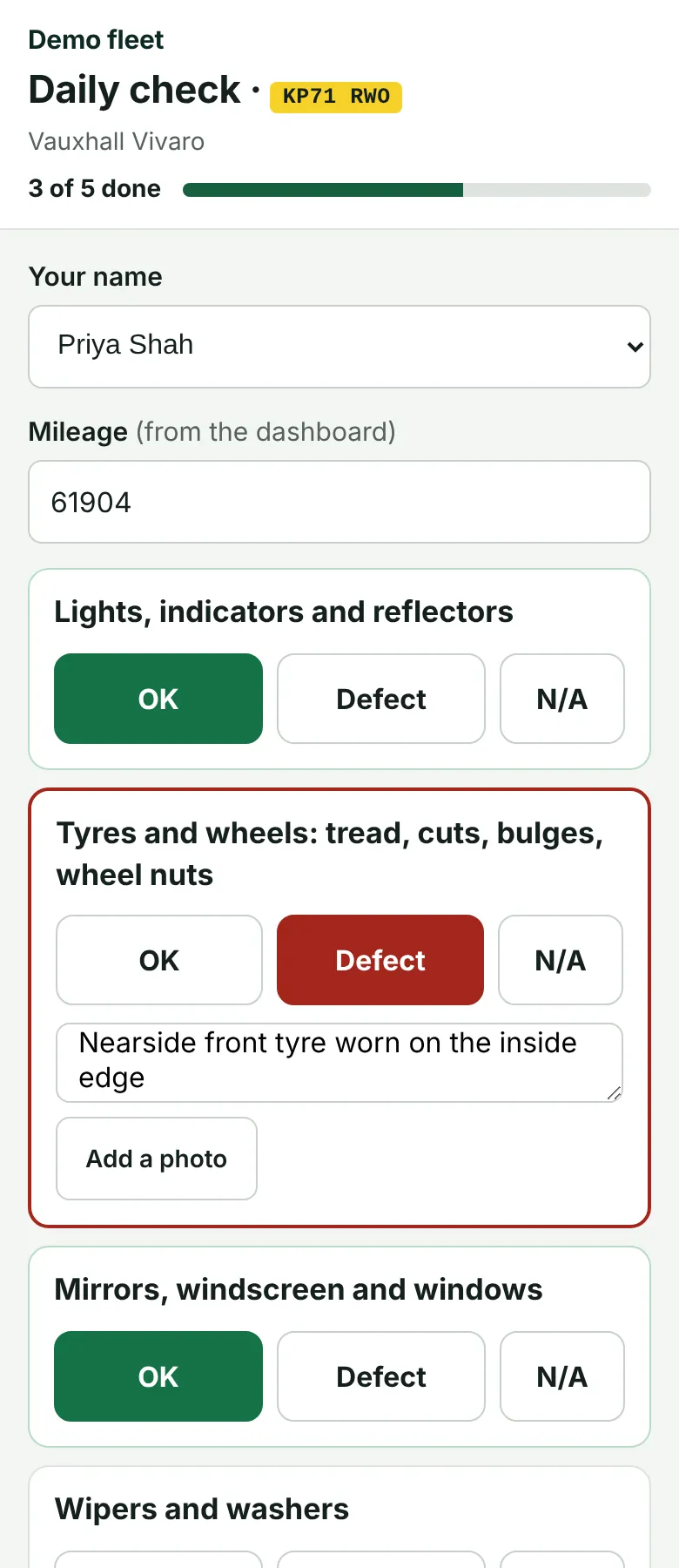 The daily van check on a driver’s phone, each item marked OK or Defect.